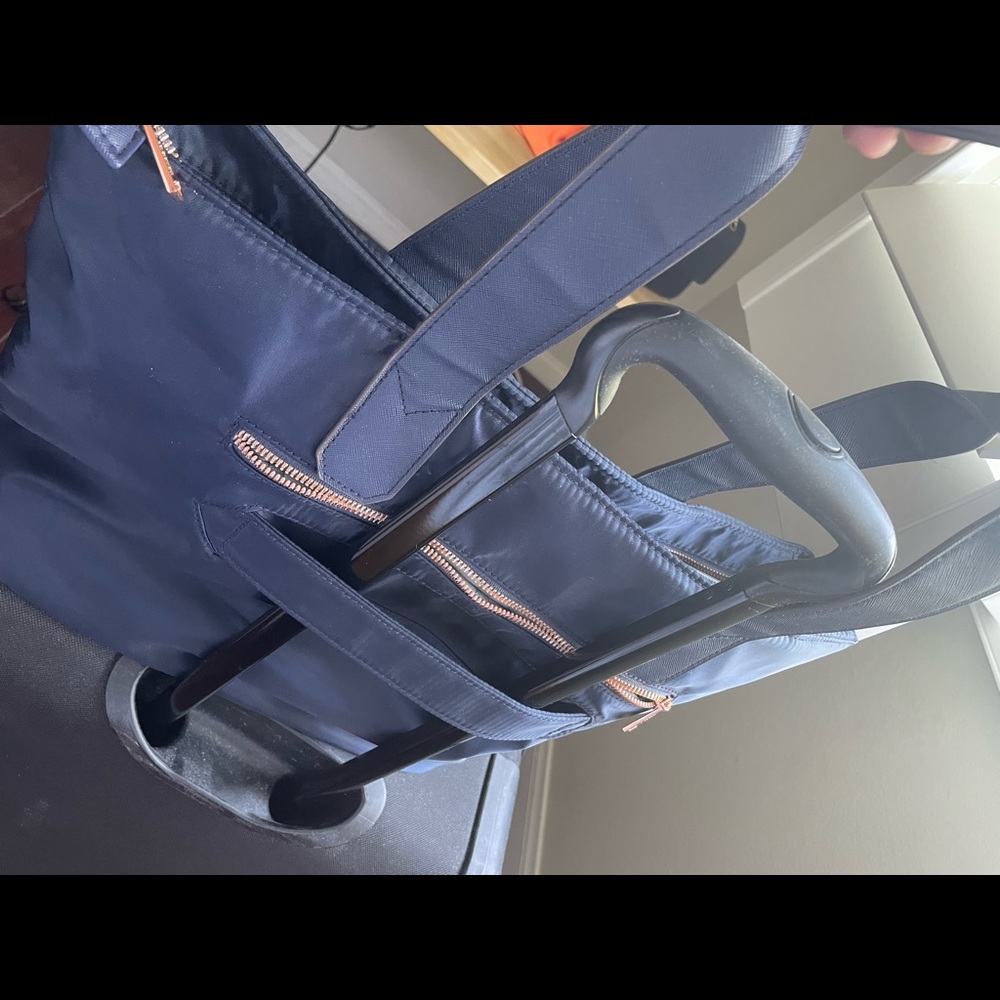 Carry-on navy tote with slip to slide on handle of carry-on by Aimee Kestenberg